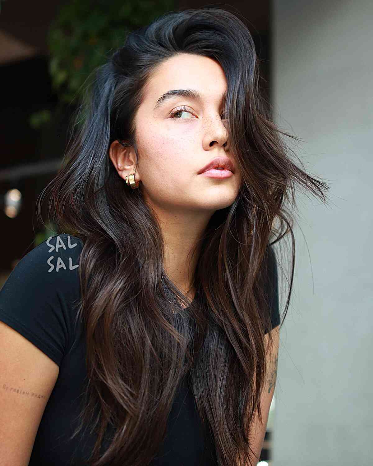 Long Layered and Side Parted Simple Hairstyle for women with an edgy style