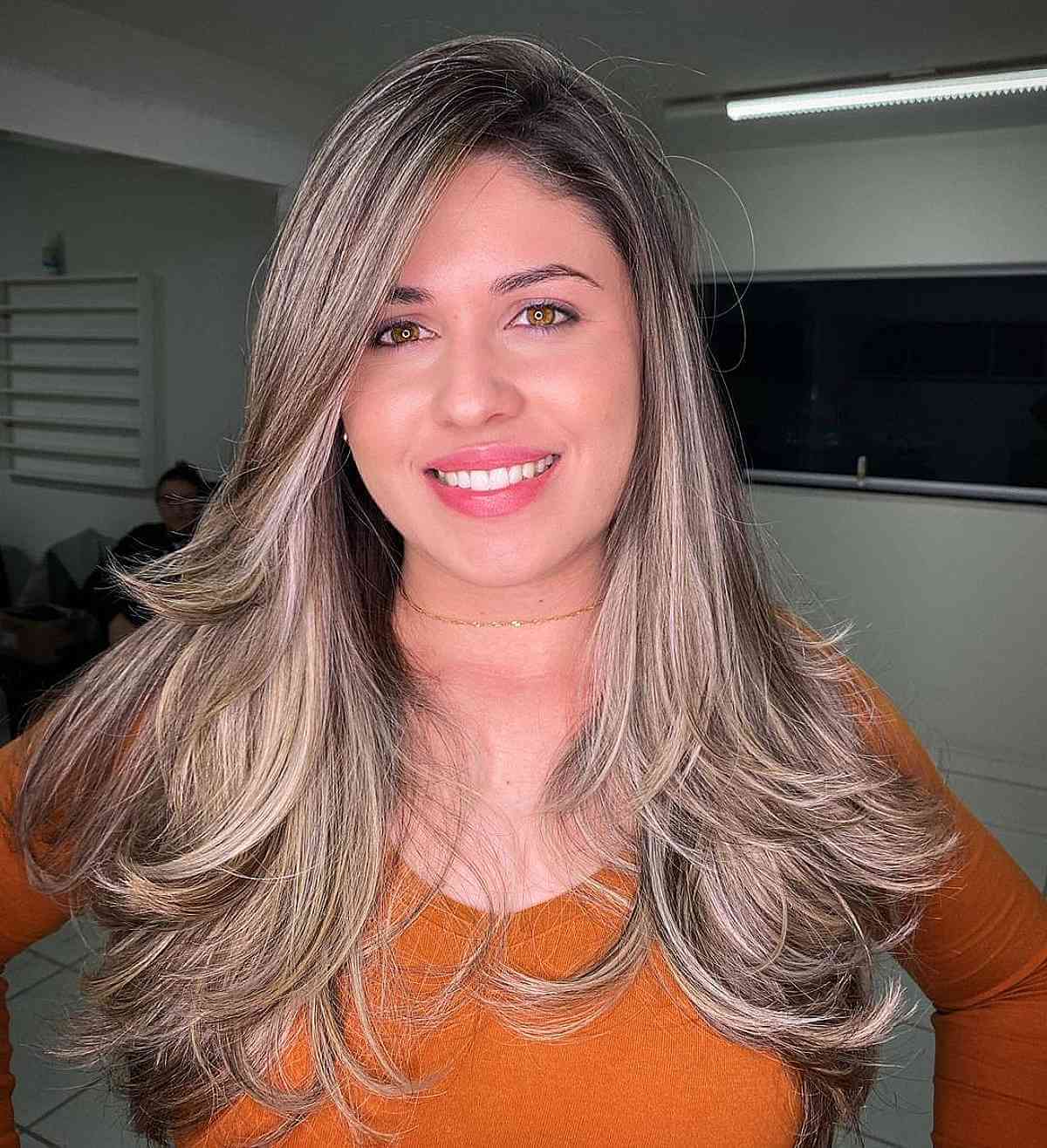 Feminine Long Layered Straight Hair with a Side Part