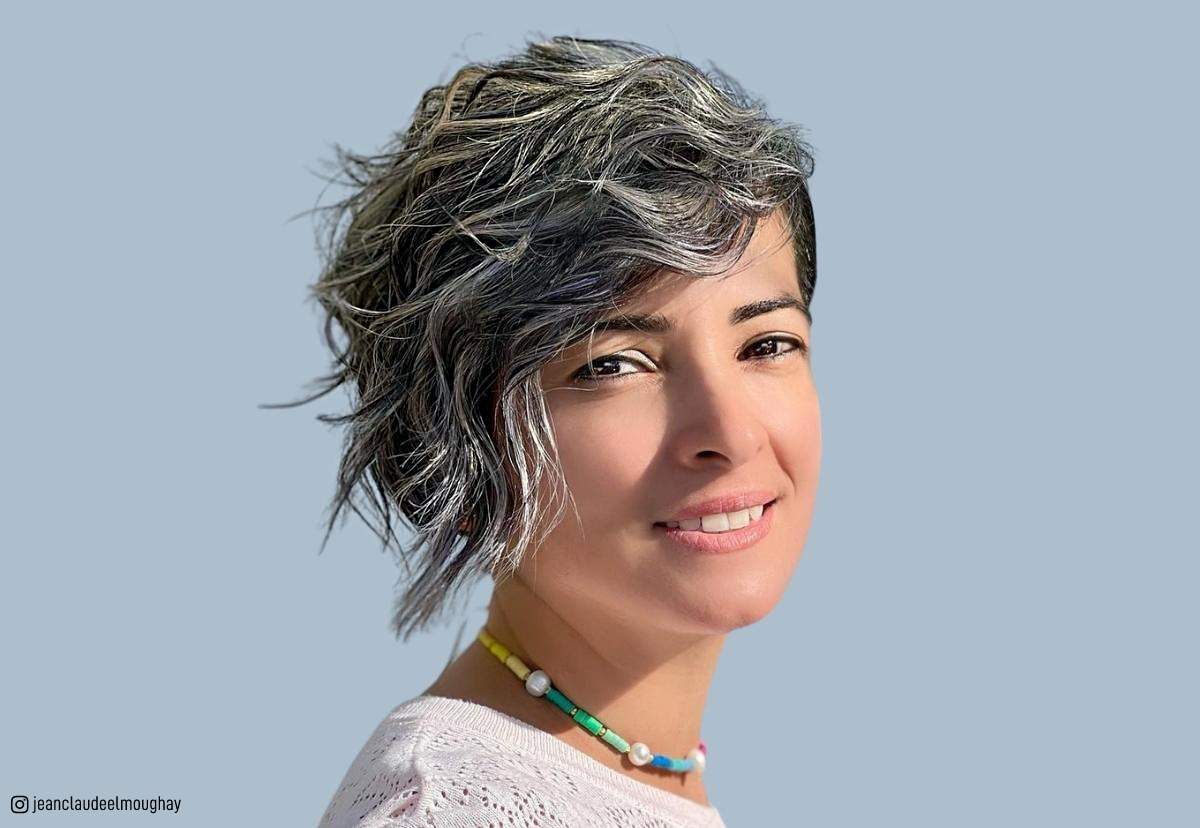 Image of Shaggy pixie with side swept bangs wavy hair