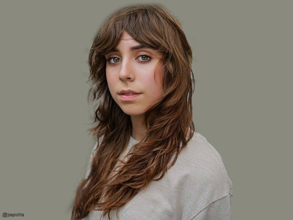 Image of Medium length wavy shag with curtain bangs