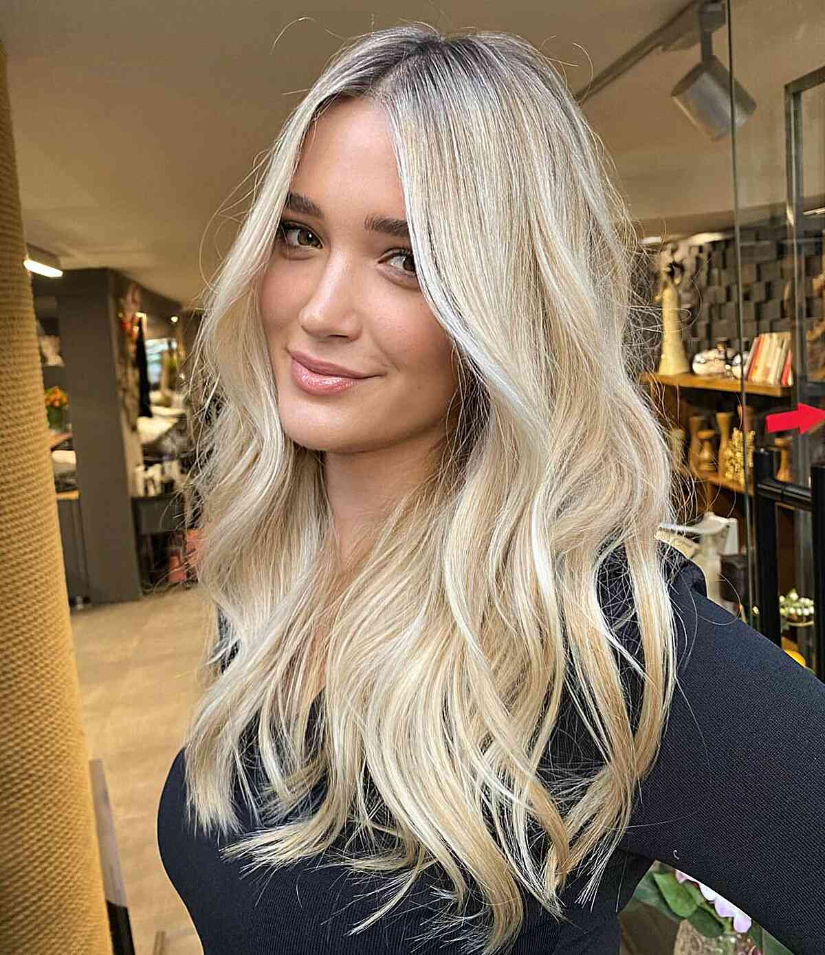 Long Wavy Cowgirl Hairstyle with Dark-Rooted Blonde Color