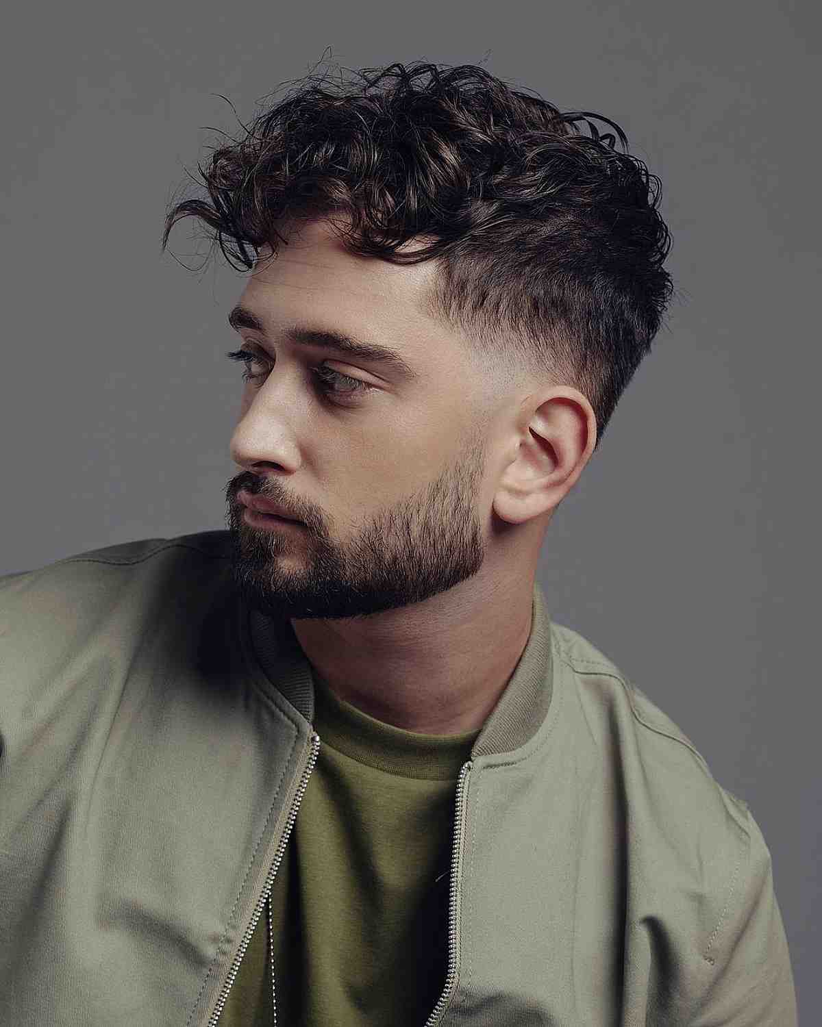 Loose Curly Hair with a Gradual Fade for Dudes