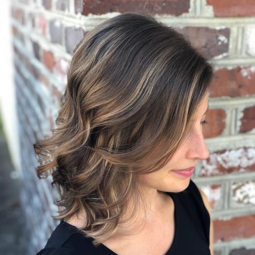 Adding bangs to a hairstyle is similar adding a cherry to the laissez passer on of an H2O ice cream sunday 53 Medium Hairstyles With Bangs: Our Latest Faves!