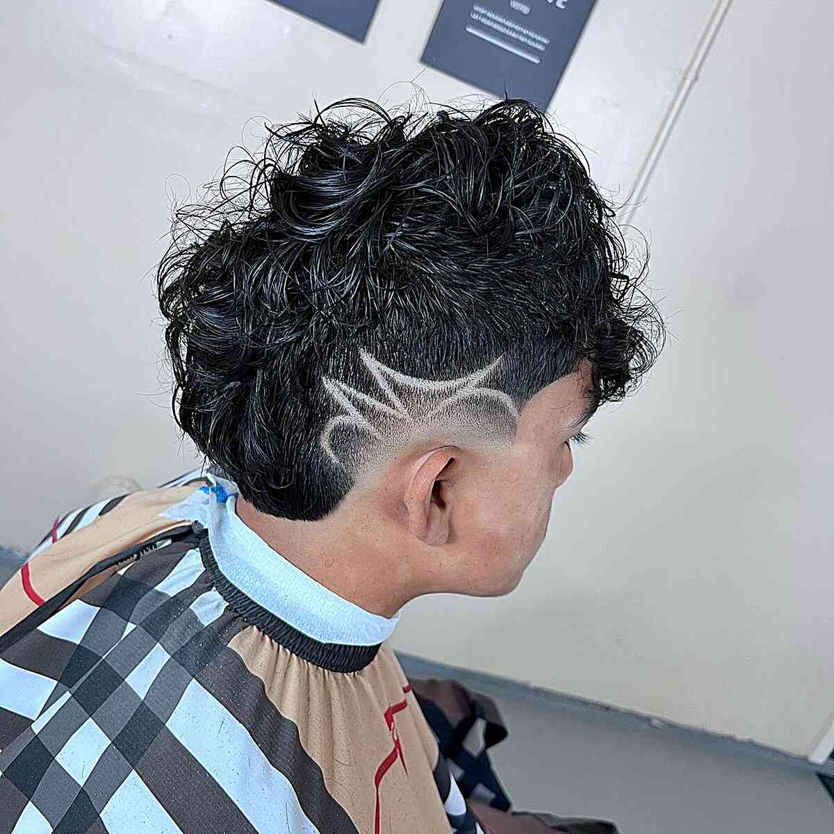 Edgy Low Burst Fade Long Hair with Shaved Design for Guys