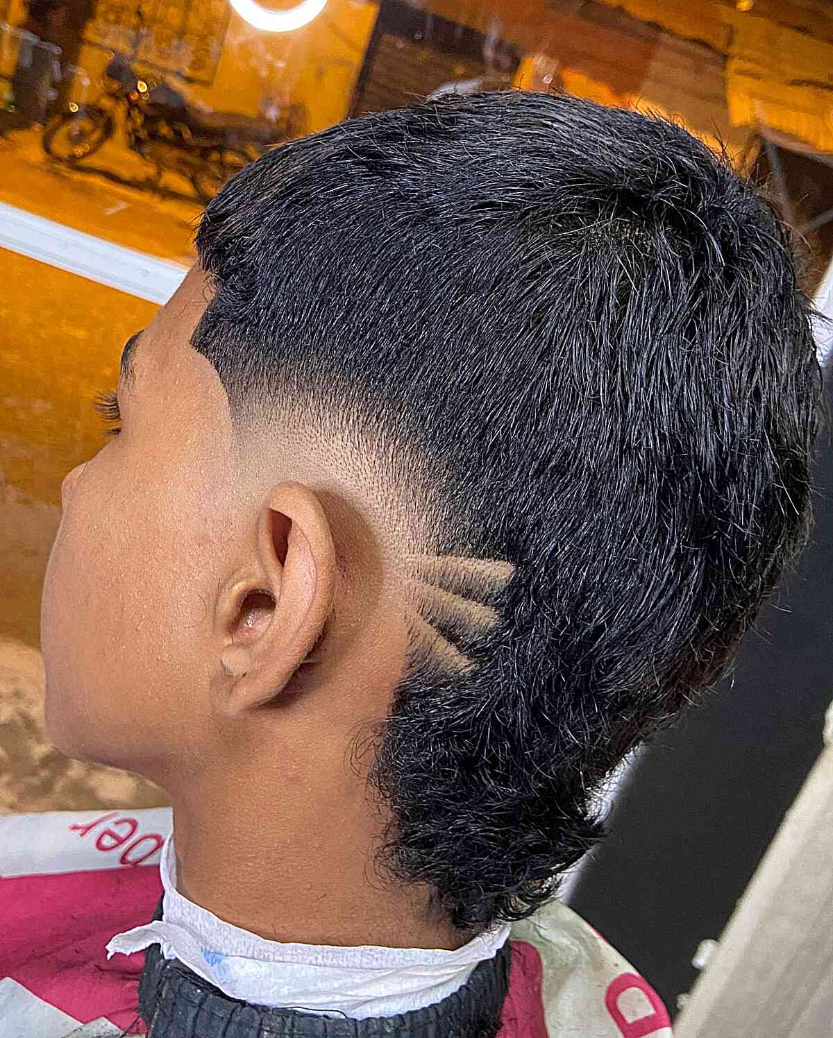 Low Burst Fade Mullet with Shaved Lines on Boys