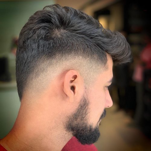 A imitation hawk fade is a type of fade that complements a imitation hawk hairstyle yesteryear adding contra xv Lit Faux Hawk Fade Haircuts for Guys