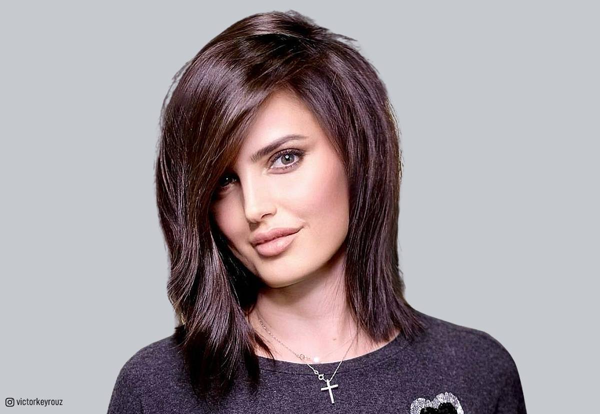 Image of Side-swept bangs with face-framing layers shaggy layered medium hairstyles