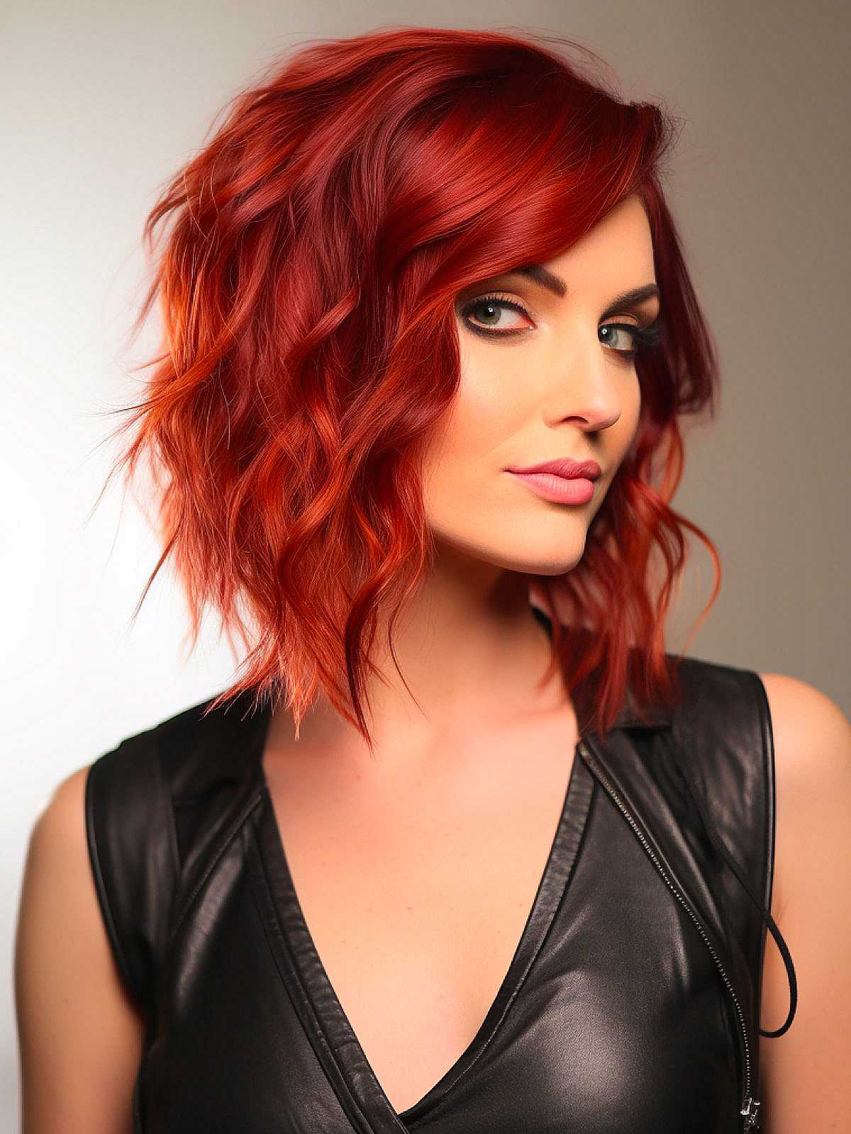 A-line medium-length wavy haircut with side bangs