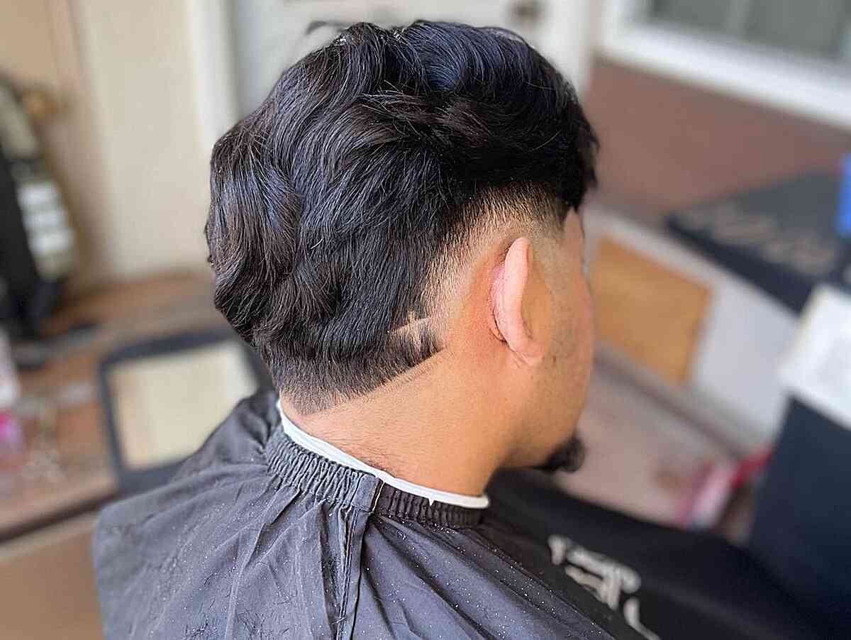 Mid-Burst Faded Wavy Hair with a Shaved Cross Design for Guys