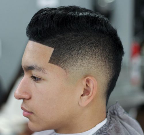 A imitation hawk fade is a type of fade that complements a imitation hawk hairstyle yesteryear adding contra xv Lit Faux Hawk Fade Haircuts for Guys