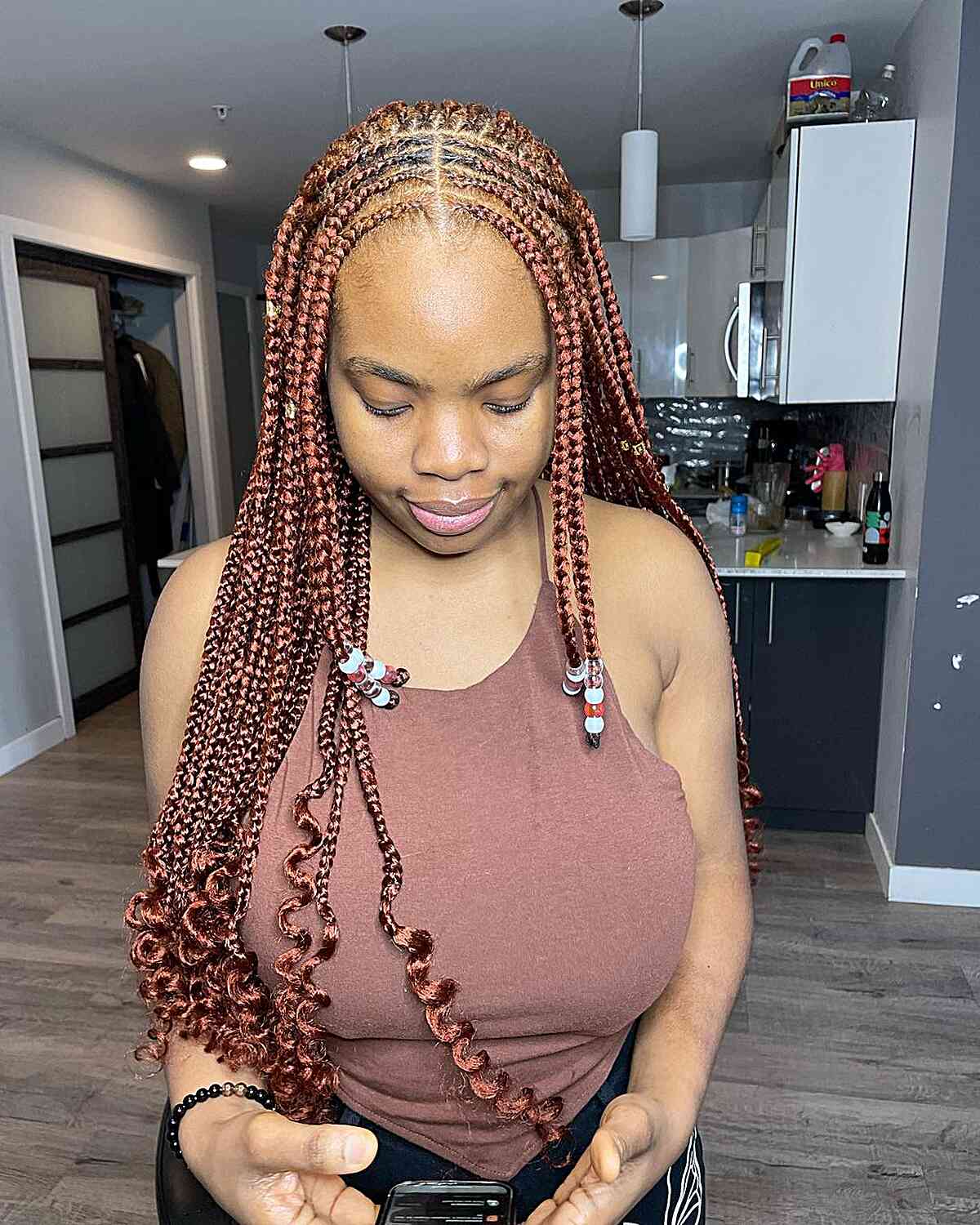Waist-Length Middle Part Ginger Knotless Braids Cornrows with Curled Ends and Beads