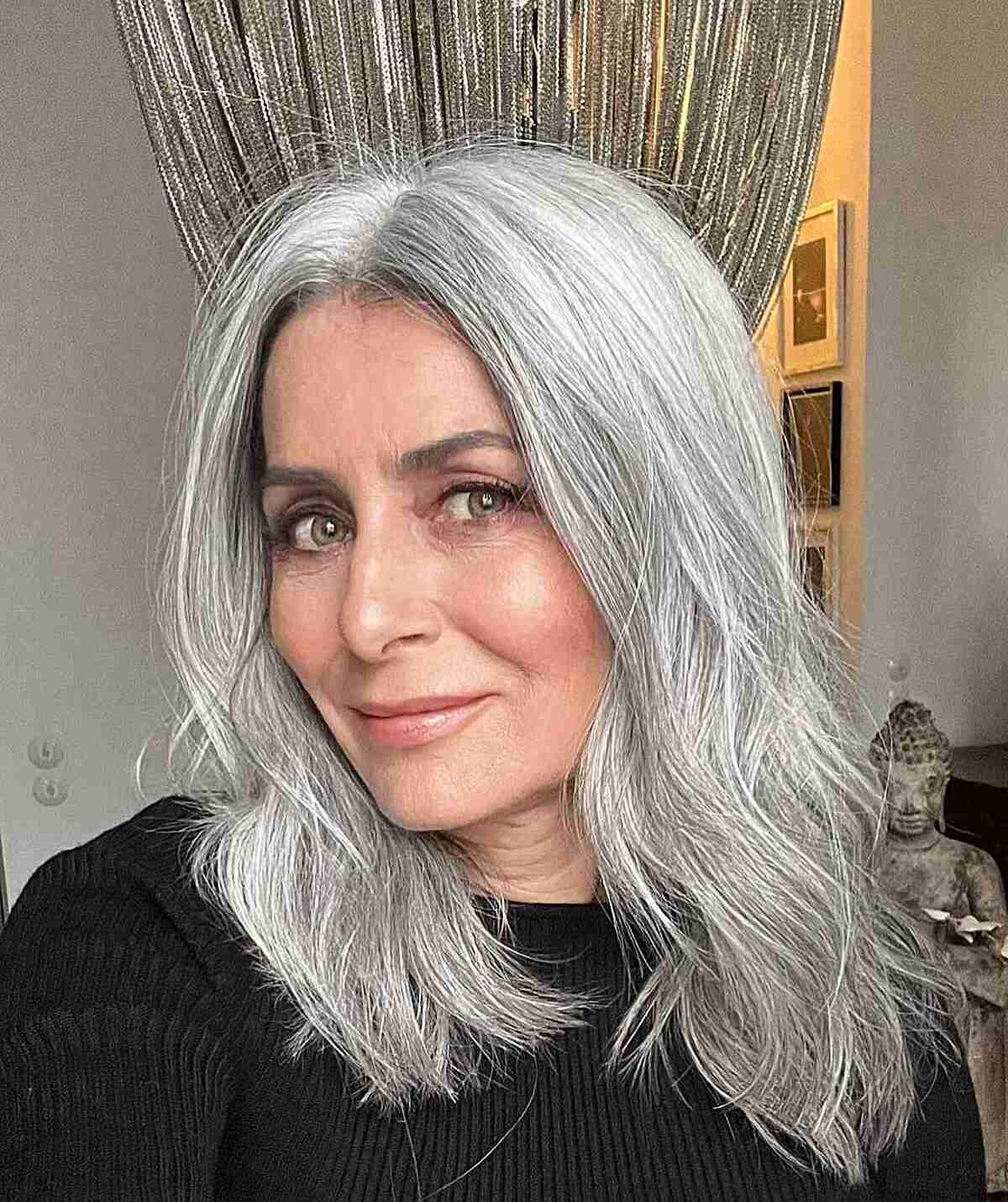 Middle Part Grey Hairstyle with Soft Layers for Women Over 50 and Up