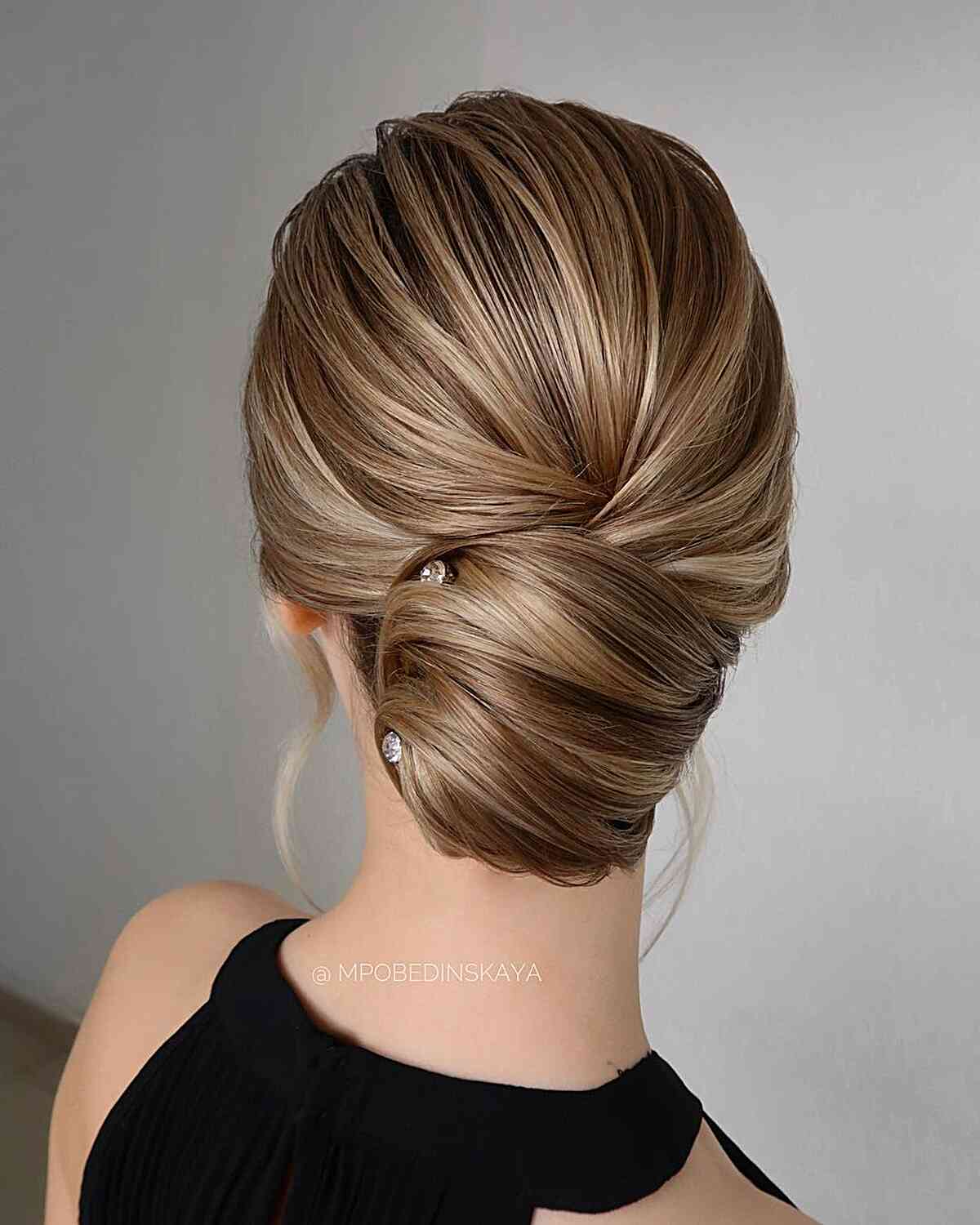 Modern bun updo for medium hair