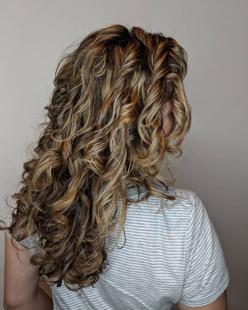 With texture at the forefront of pilus fashion these days 23 Cutest Long Curly Hairstyles
