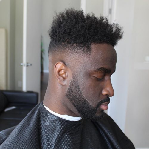 is a haircut for dark men alongside a long afro on top that The 12 Best High Top Fade Haircuts You’ll See