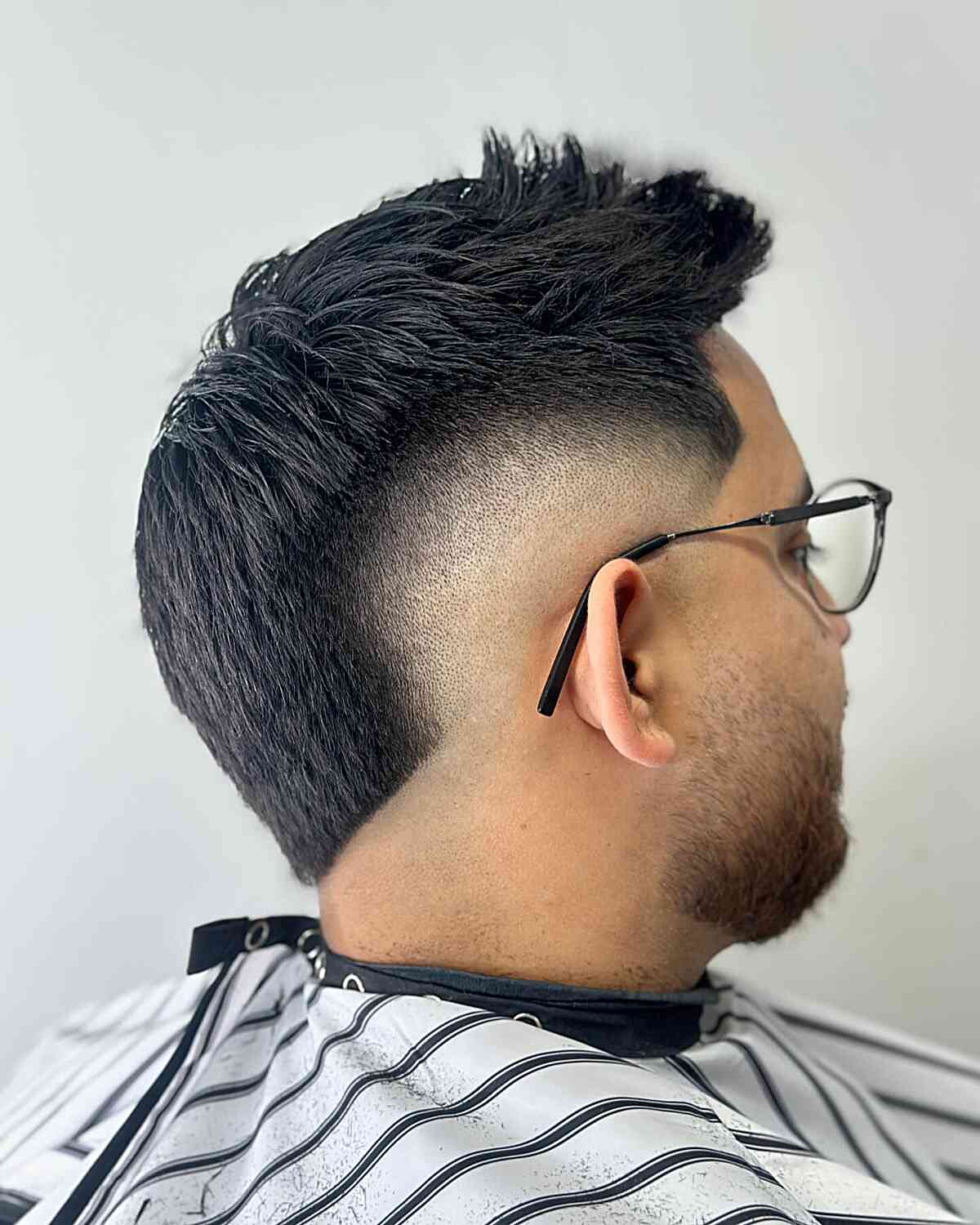 Neat Spiky Hairstyle with Mid Burst Fade Cut for Guys with Glasses