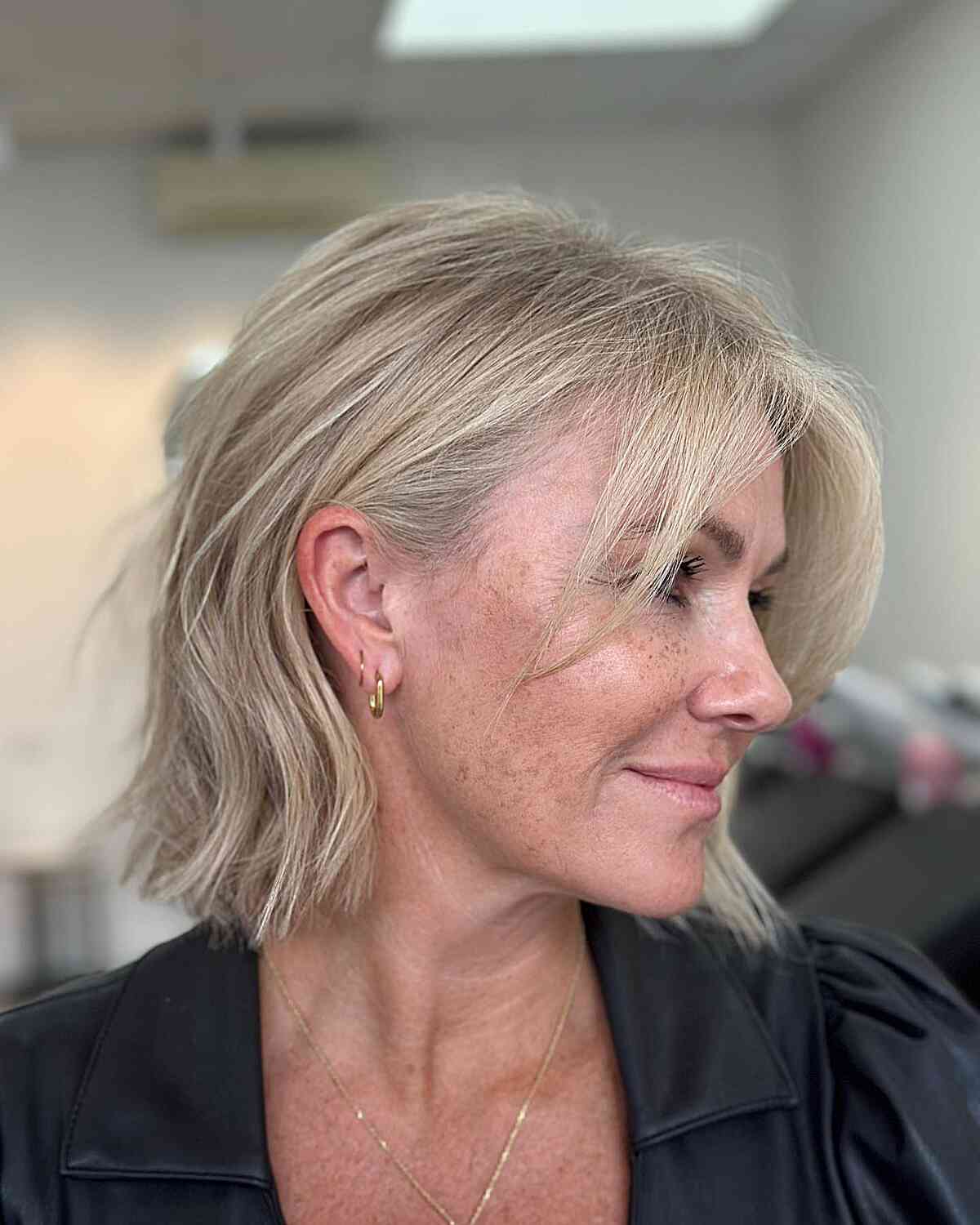 Neck-Grazing Textured Blonde Sassy Bob with Face Frame