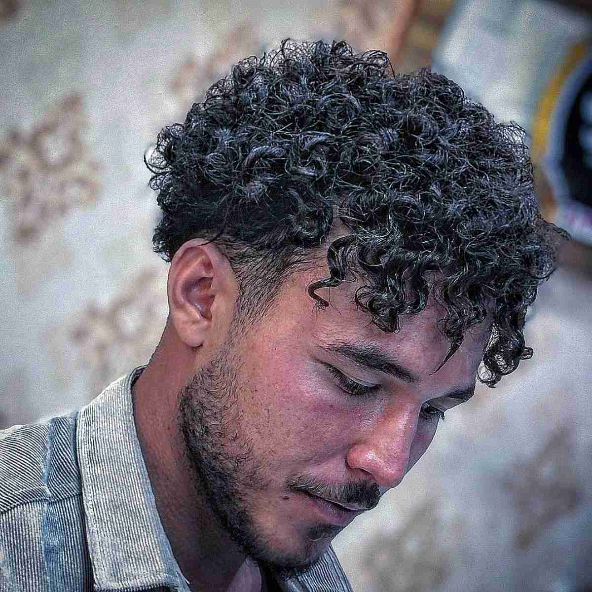 Piece-y Curly Bangs on Short Hair for Men