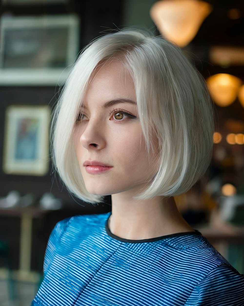 Precision pinch bob with sharp angles and light layering for fine straight hair