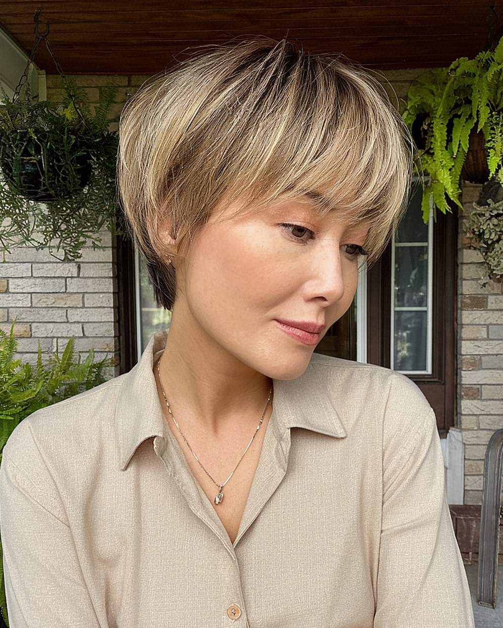 Pixie bob haircut with crown volume and fine blonde layers for women over 40