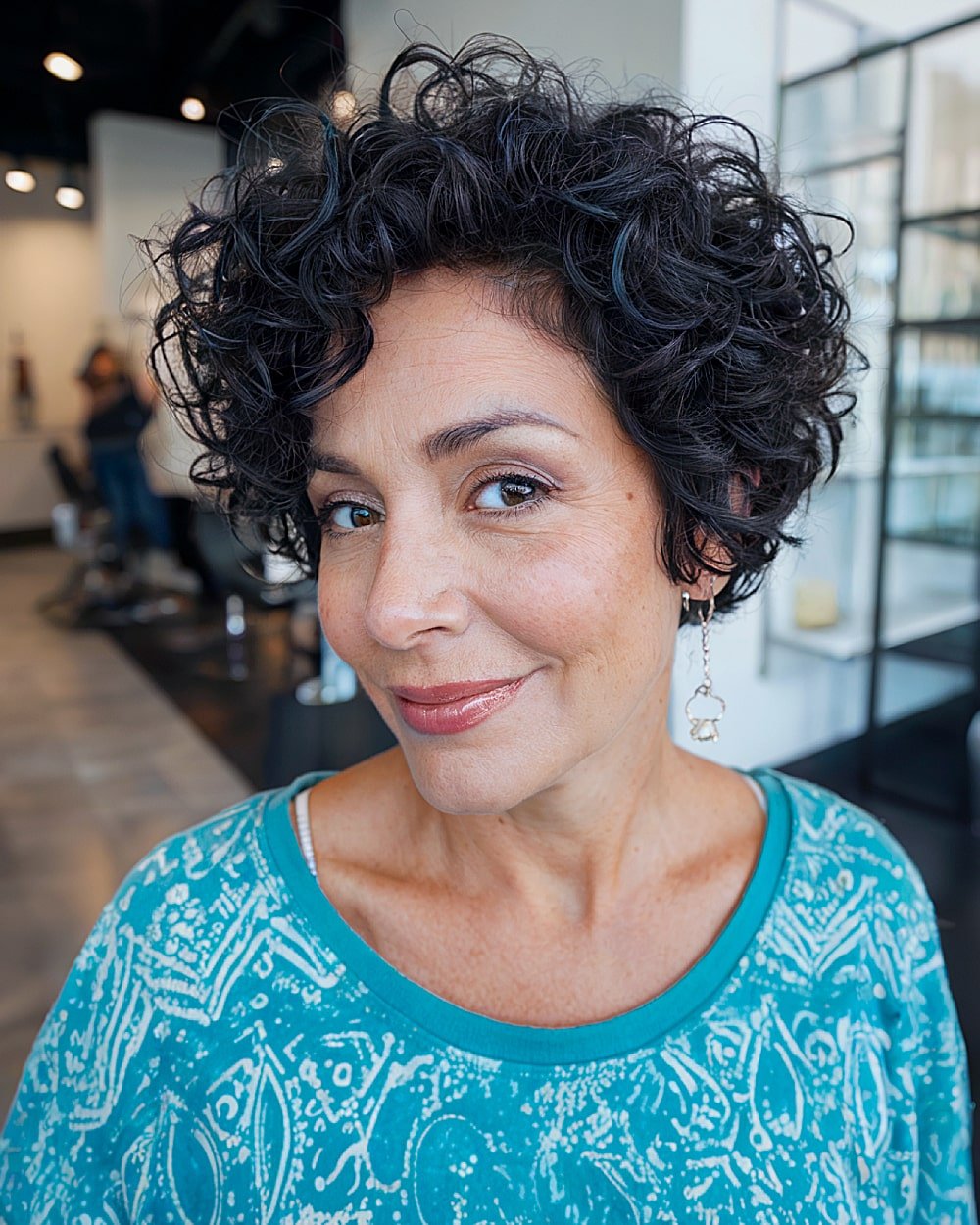 Pixie bob with curly stacked shape and tapered neckline for thick textured curls
