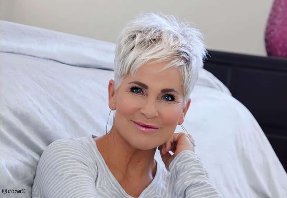 Image of Cropped pixie short hairstyle for oval face over 50