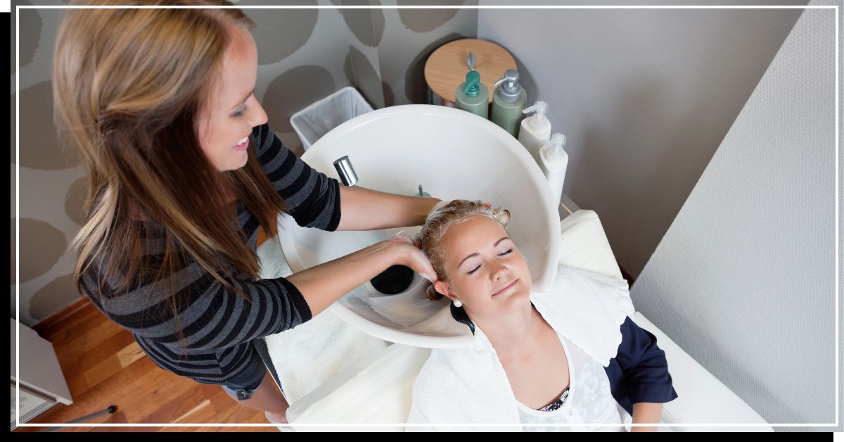 Salon assistant shampooing the client