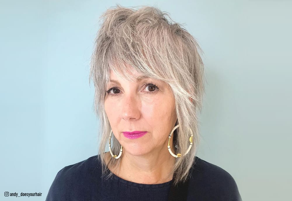 Image of Graduated shag haircut with soft waves for women over 50