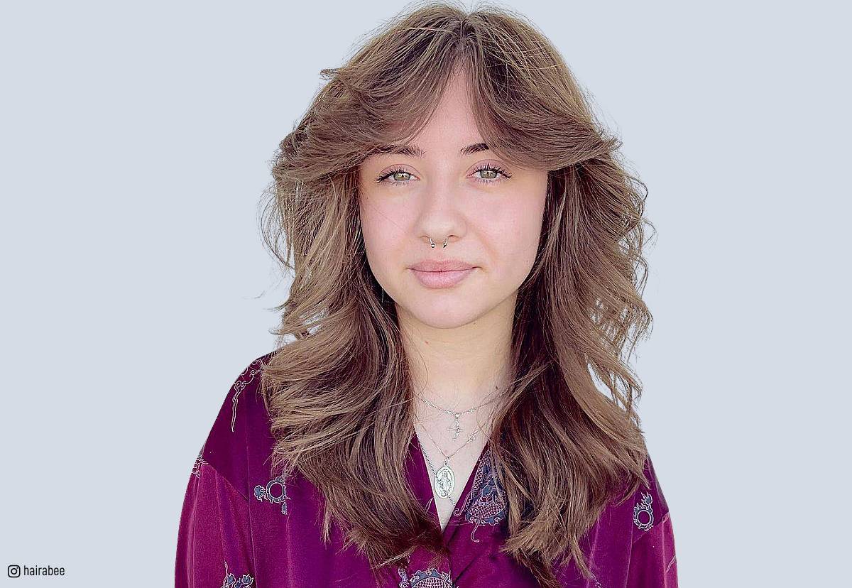 Image of Long choppy shag haircut with curtain bangs