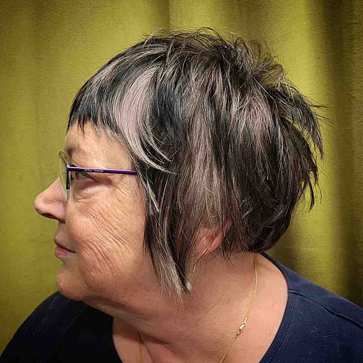 Short Shaggy Bob with Choppy Bangs and Layers for 50-Year-Old Women