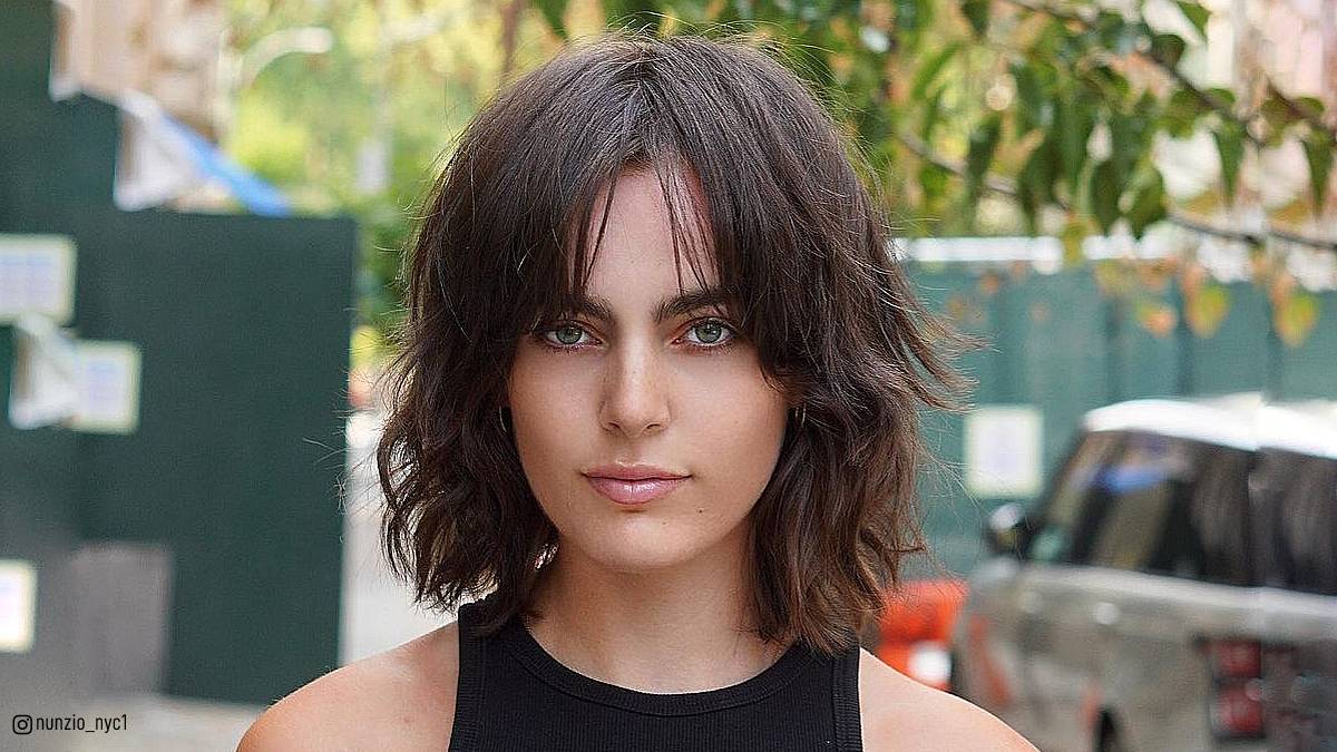 Image of Short and textured shag with curtain bangs black hair