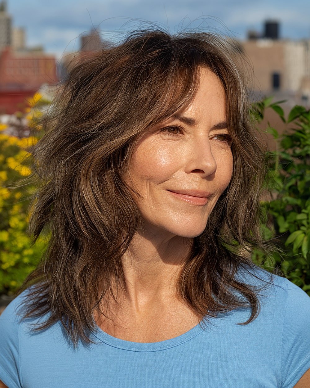 Long shaggy haircut without bangs and subtle face-framing layers for women over 50