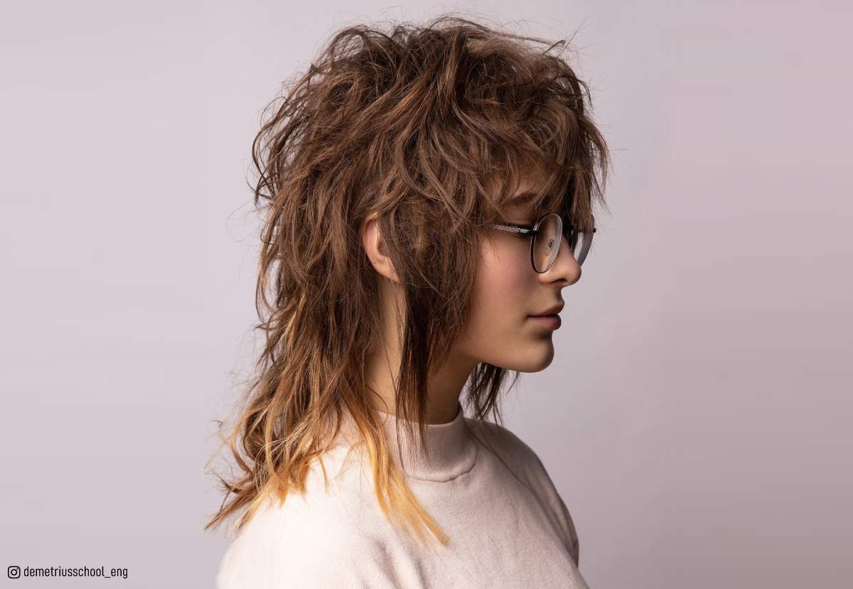 Image of Woman with long blonde shaggy hair in a braid