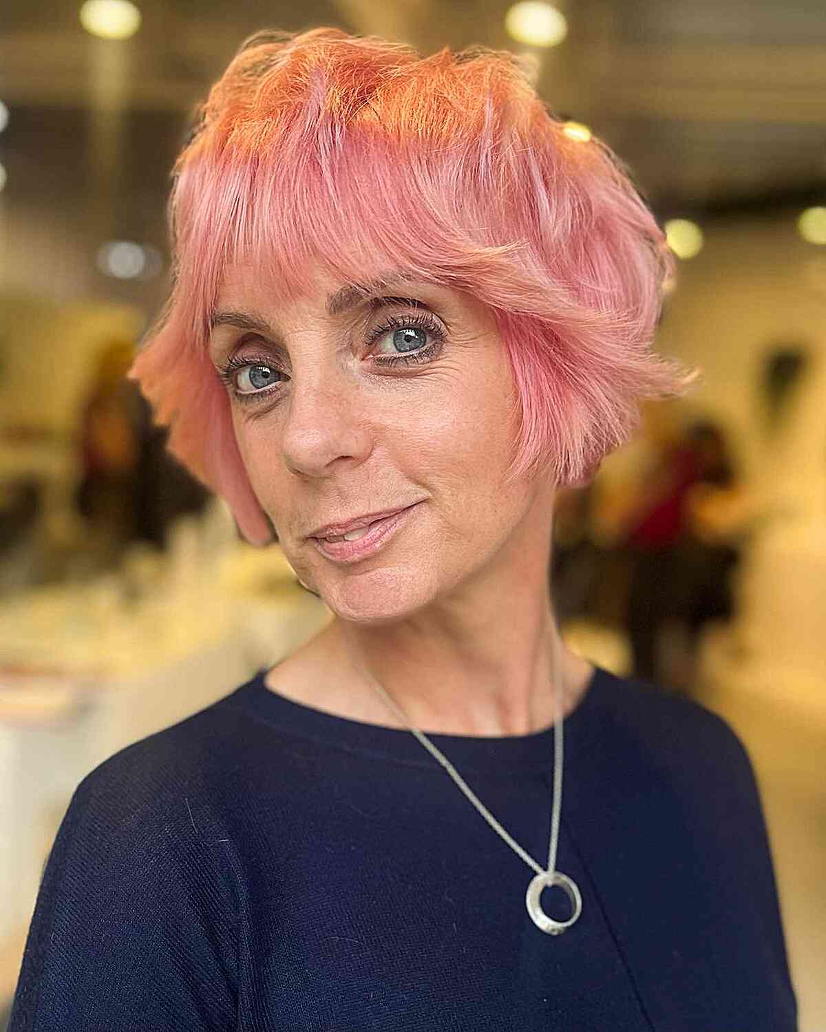 Jaw-Length Shaggy Pink Bob with Eye-Grazing Fringe for women in their 50s