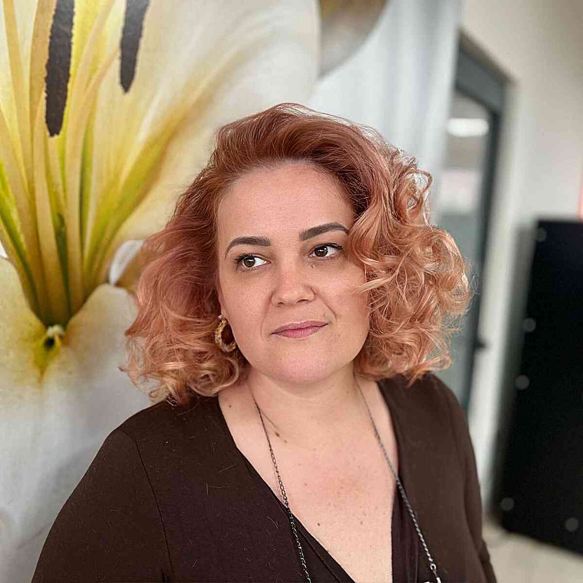 Short Curly Hairstyle Without Bangs for women with large foreheads