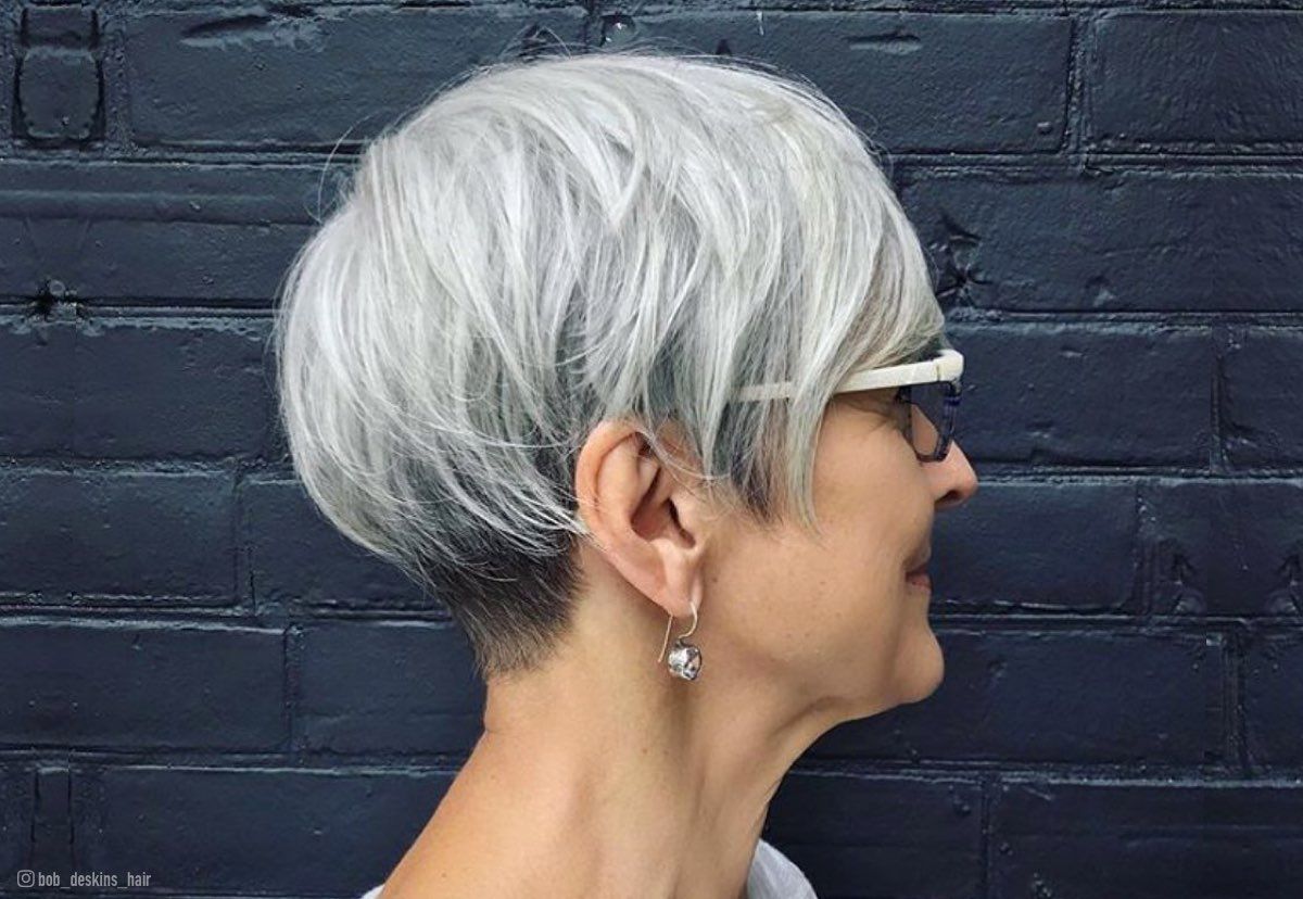 Image of Short razored shag haircut with blunt hem for women over 60