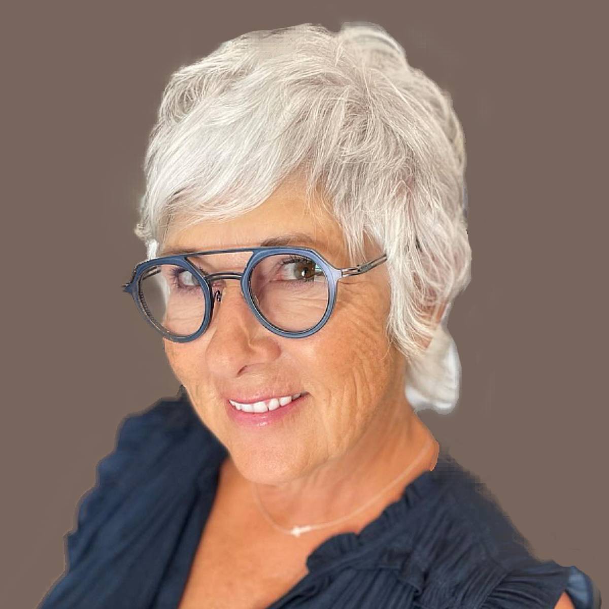 Image of Short textured shag haircut with messy finish for older women