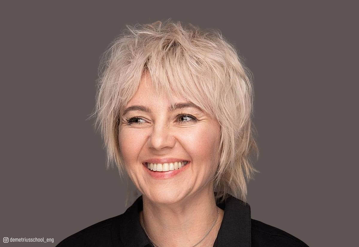 Image of Face-framing choppy shag hairstyle for women over 50 with oval face