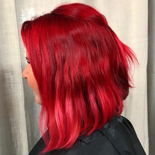 warm as well as intense shade of ruby-red dyed onto the pilus inwards the cast of highlights sixteen Stunning Bright Red Hair Colors to Get You Inspired