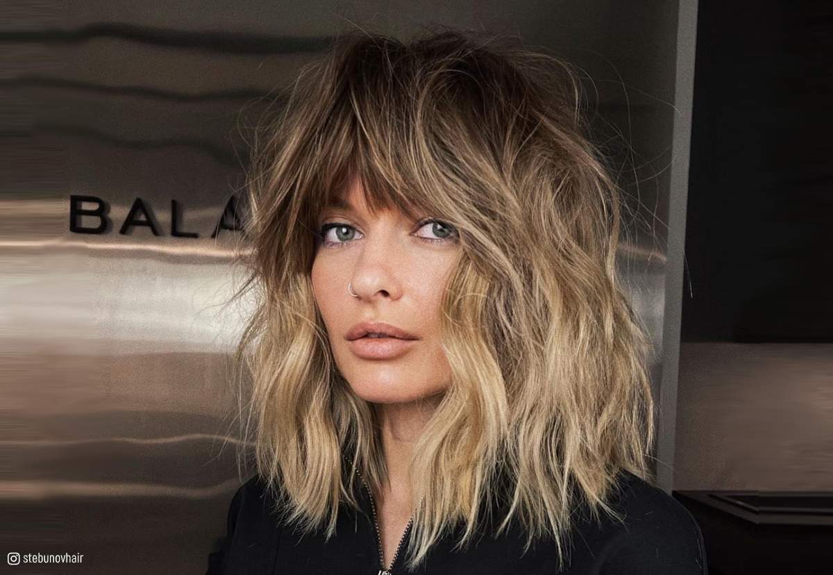 Image of Textured shoulder length wavy shag with a tousled finish