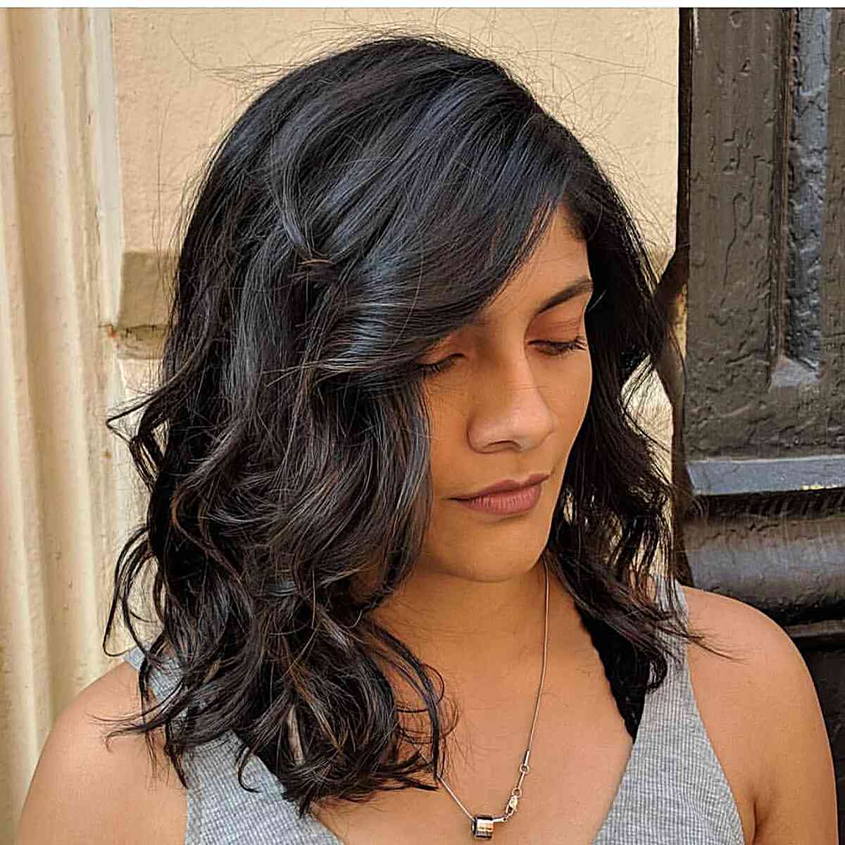 Shoulder-Length Jet Black Waves in Hair