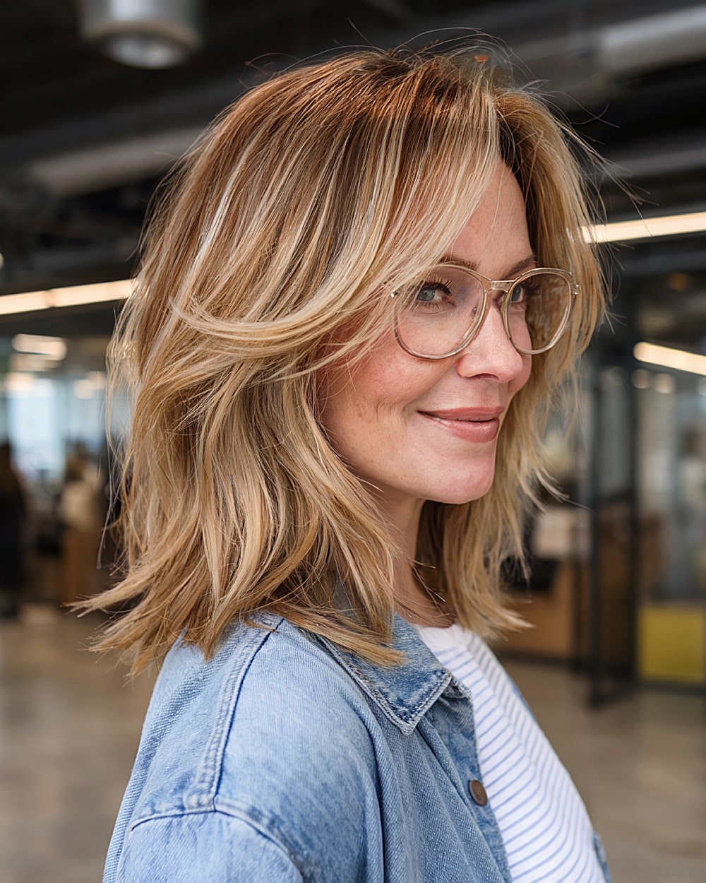 Shoulder-length layered hairstyle with feathered ends and volume for an alt-layered haircut