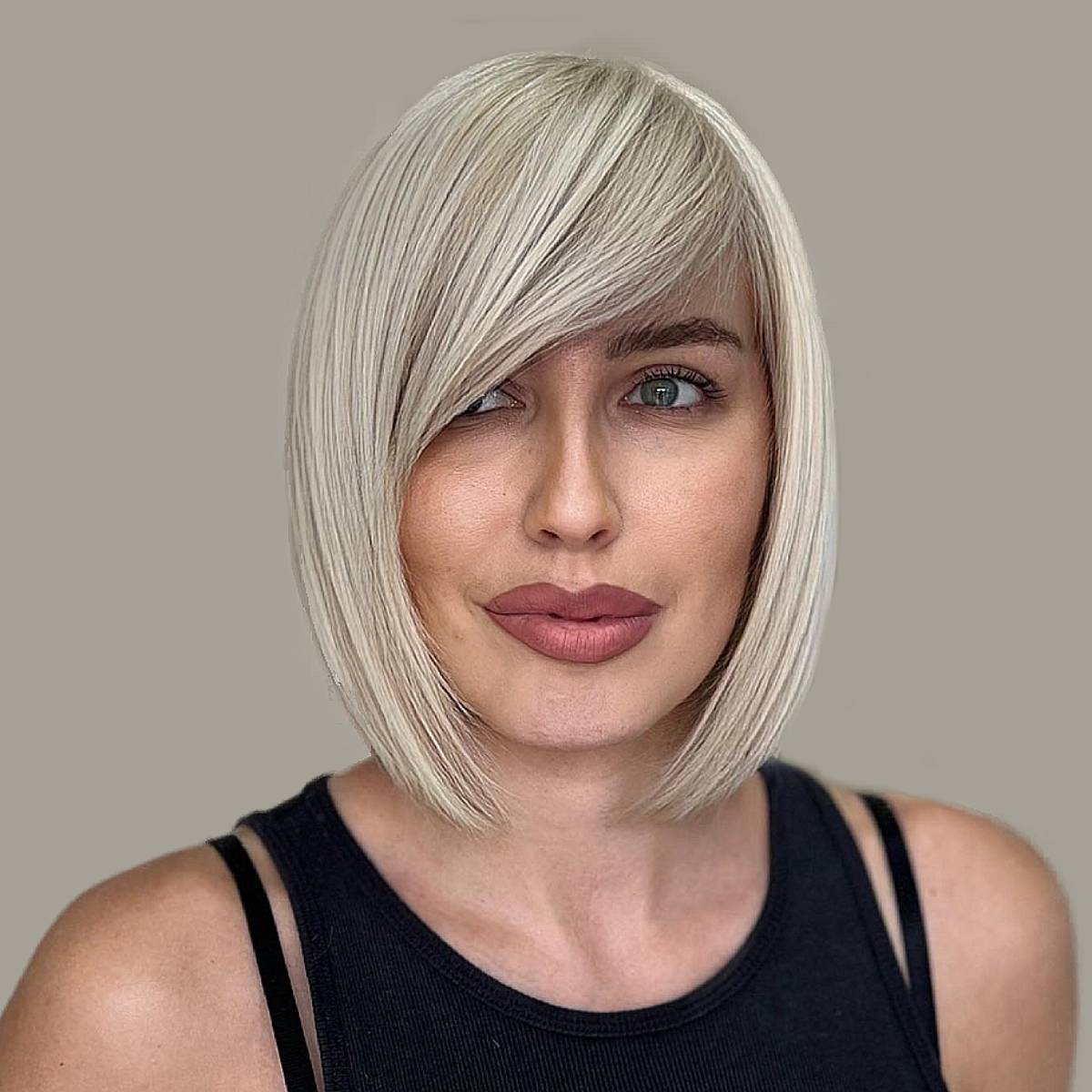 Image of V-cut bob hairstyle with side bangs girl