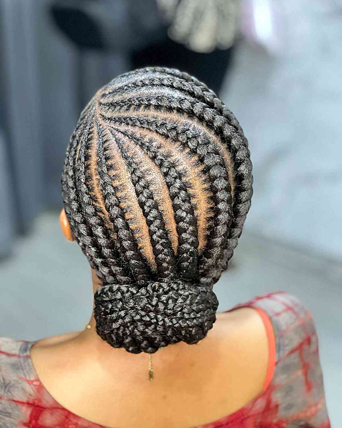 Side-Parted Stitch Braids with Low Bun