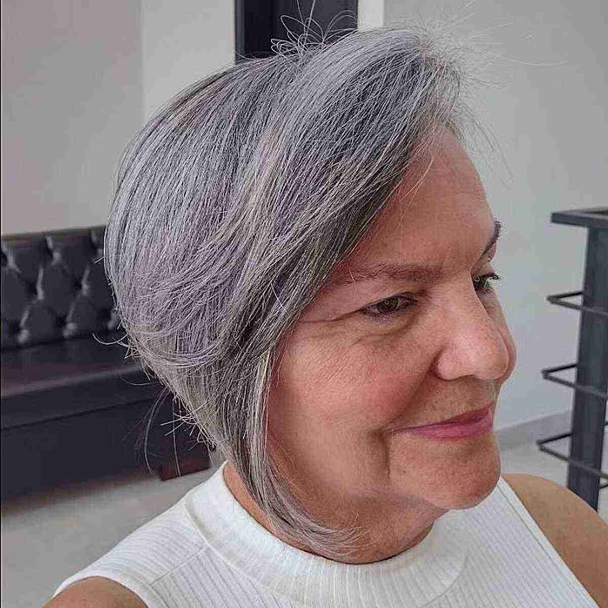 Side-Swept Gray Angled Bixie with Long Fringe for Women Over Seventy