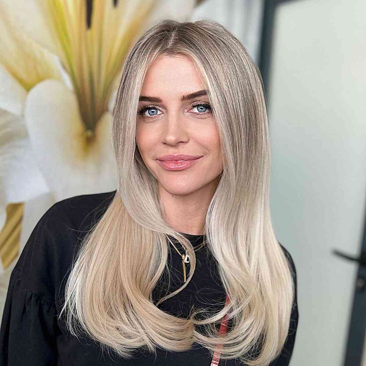 Silky Smooth Long Straight Hair with a middle part and slightly curled ends