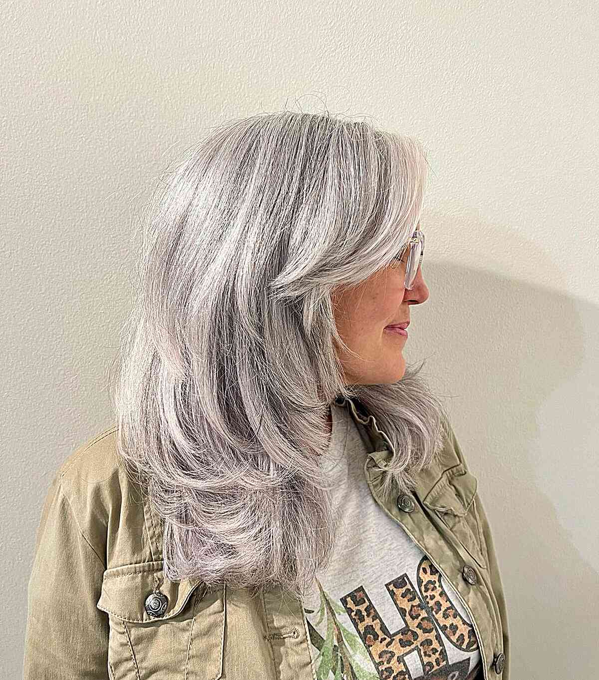 Mid-Long Silver Blonde Hair with Feathered Layers for Older Women with Grey Hair
