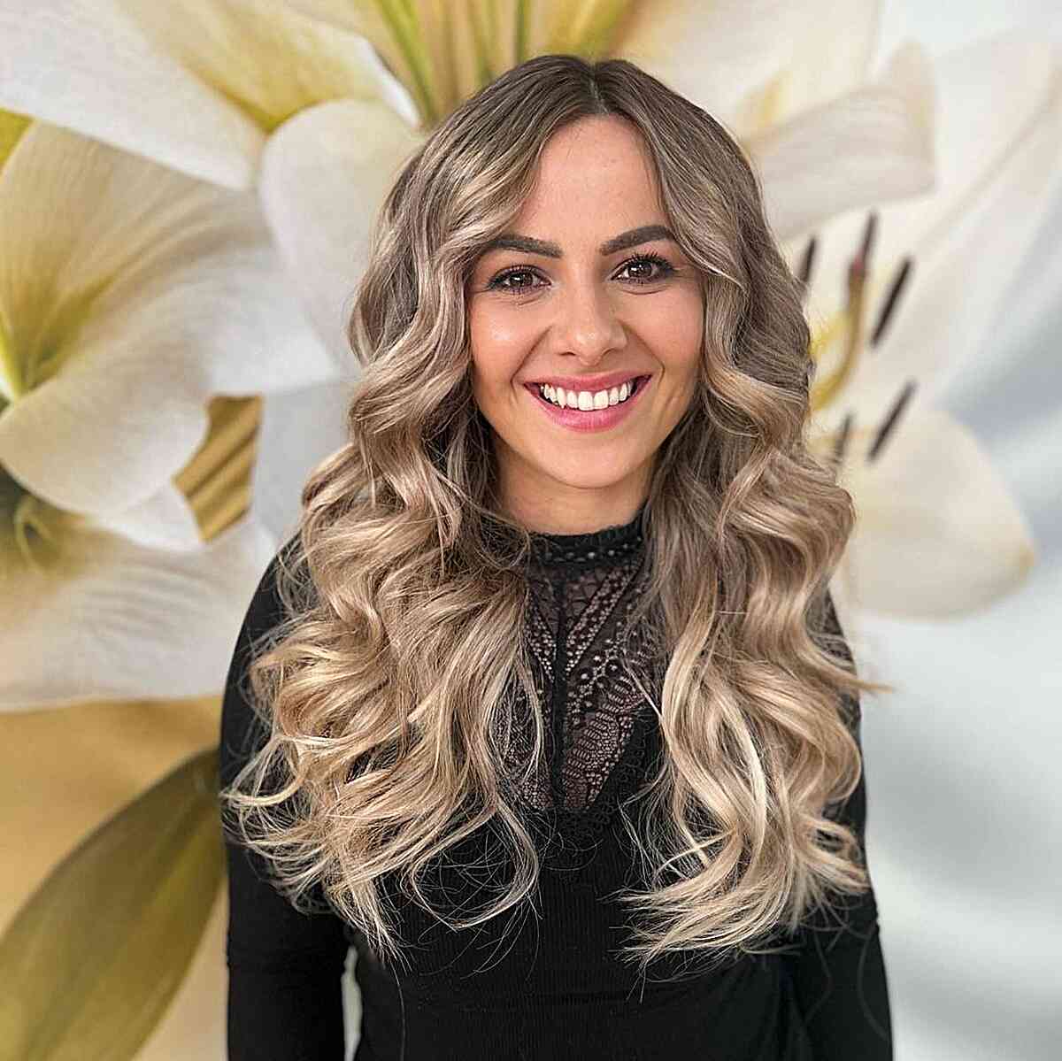 Simply Curled long hair with a middle part and face-framing layers