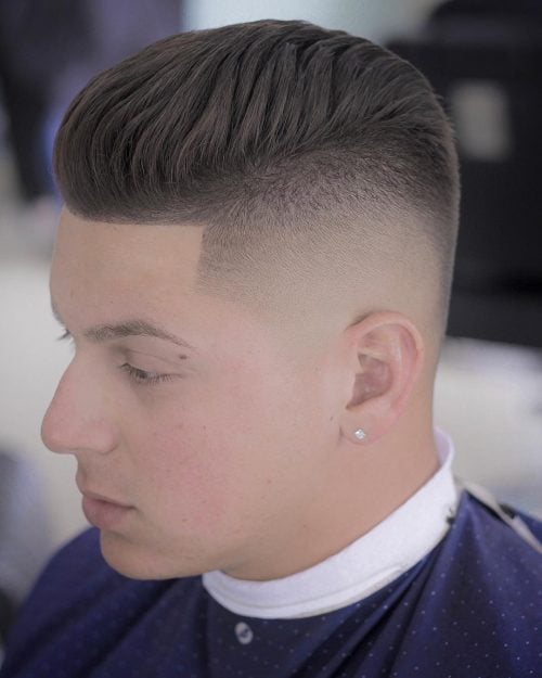 A imitation hawk fade is a type of fade that complements a imitation hawk hairstyle yesteryear adding contra xv Lit Faux Hawk Fade Haircuts for Guys