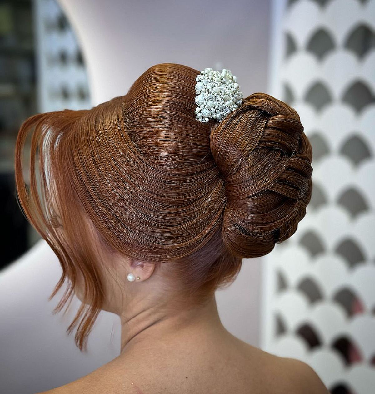 Sleek and Unique Overlapping Chignon with Long Bangs for Gala Night